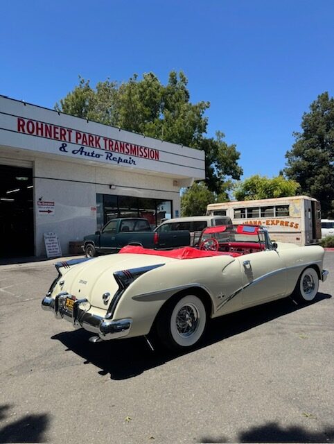 Classic white roadster parked in front of Rohnert Park Transmission and Auto Repair