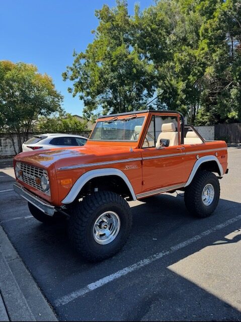 Orange vintage Ford Bronco parked outside Rohnert Park Transmission