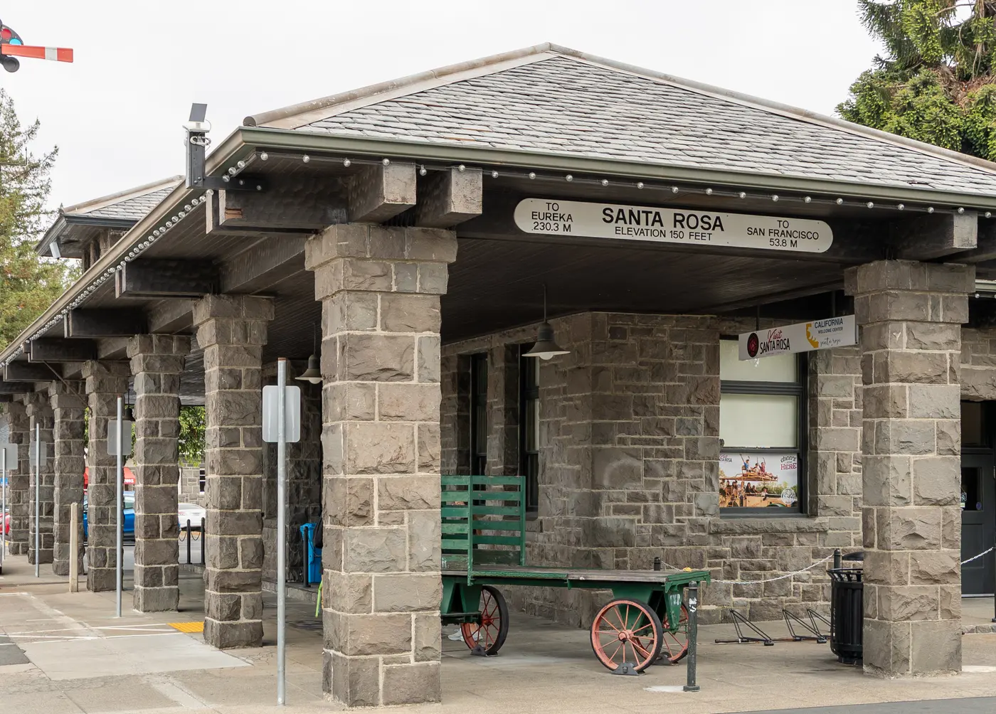 Stone railroad depot at Railroad Square in downtown Santa Rosa, with its sign reading Santa Rosa, elevation 150 feet